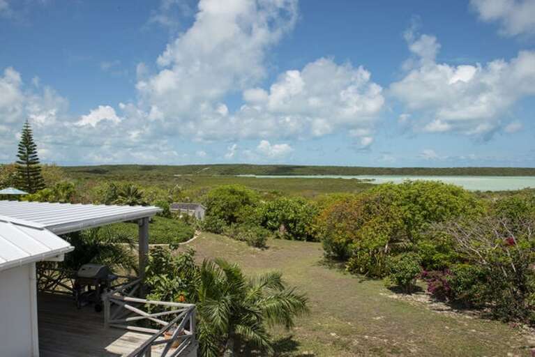 View of house and grounds overlooking Savannah Sound on one side and the ocean on the other.