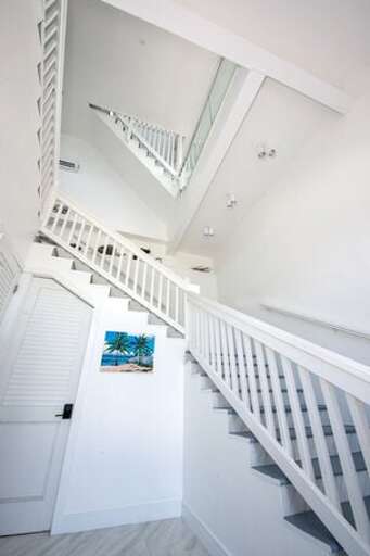 Entrance hall and grand stairway. Powder room on the left(7th bathroom).