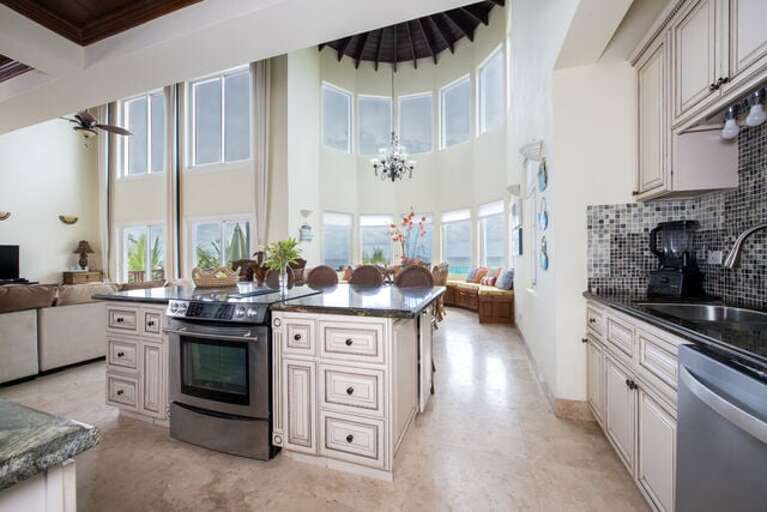 This spacious kitchen includes a huge island, exotic granite countertops, and state-of-the-art stainless steel appliances.