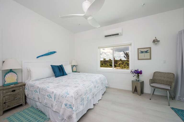 2nd bedroom on Upper Level offering one king bed or 2 extra long single beds.