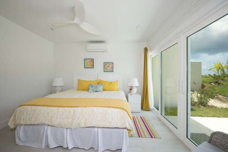 Bedroom 3 on lower level with ocean view, offering one king bed or 2 extra long single beds