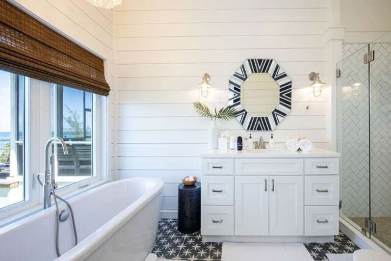 Master bathroom with walk-in shower and soaker tub.