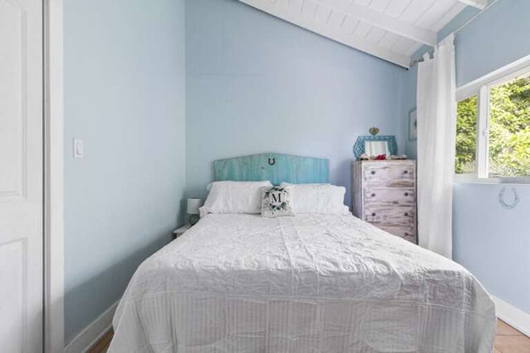 3rd bedroom - "Horseshoe" themed with king bed and garden view.
