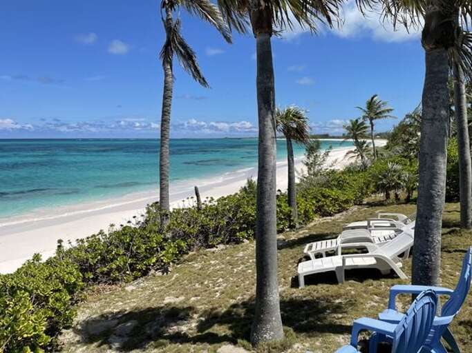 Lounge beside our pink-sand beach.