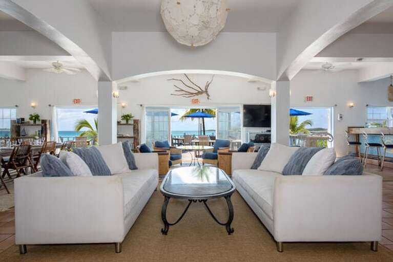 Lounge area facing the patio and beach. Lounge area facing the patio and beach.