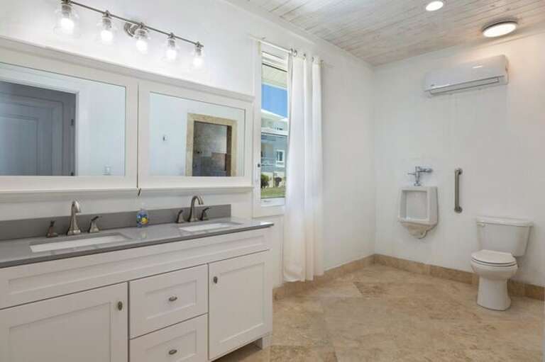 Full bath with double sinks and walk-in shower.