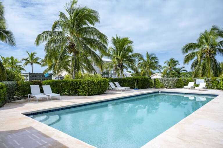 Our heated 40' x 20' pool. We also have kayaks, paddle board, bikes, golf carts, mini-gym, and fast free internet! Our heated 40' x 20' pool. We also have kayaks, paddle board, bikes, golf carts, mini-gym, and fast free internet!