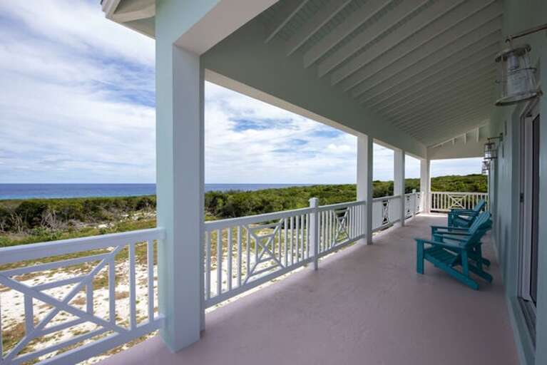 This deck is partially covered for shaded outdoor dining and partially uncovered for sunning and