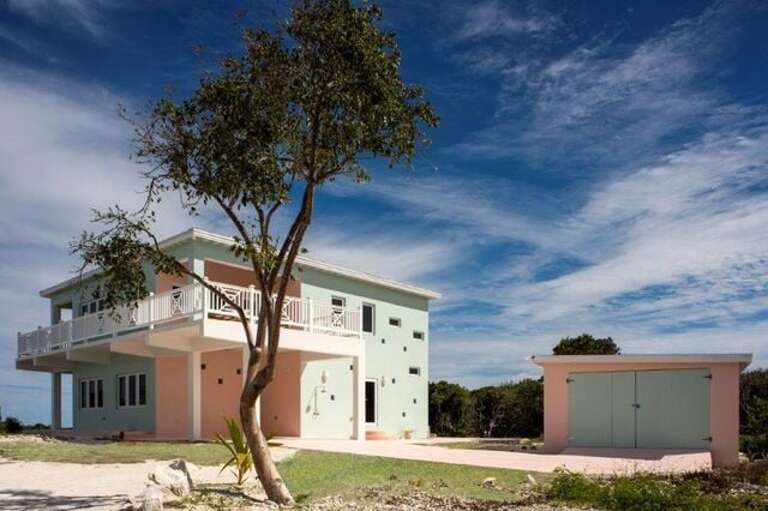 Sephora House, a brand new estate home set on 24 private gated acres 1/2 mile from Gregory Town and one mile from world-famous Surfer's Beach.