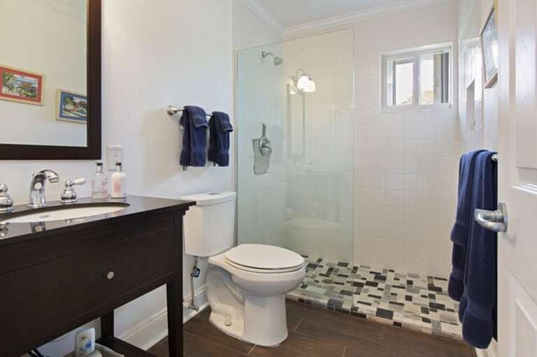 Ensuite bathrooms with walk-in shower in the guest house.