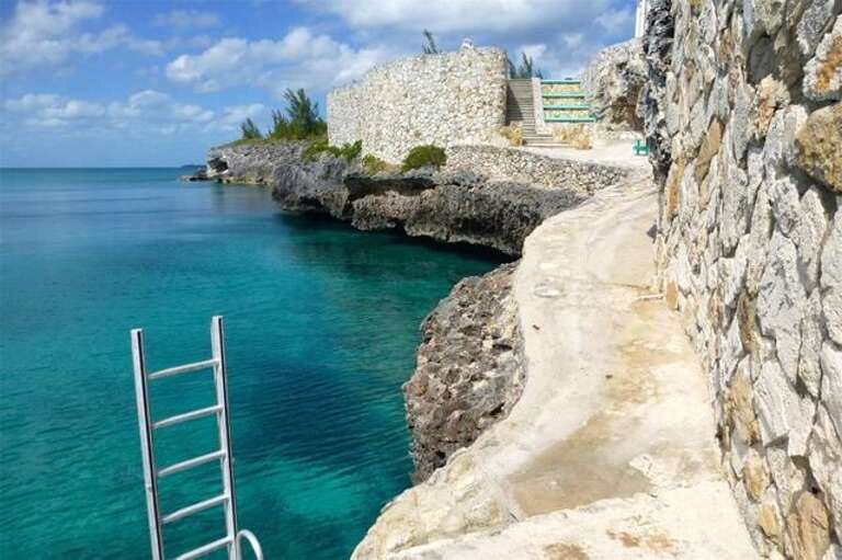 Limestone landing on the edge of the Caribbean.  A short ladder provides easy access into and out of the water.