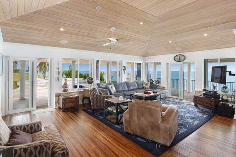 Open living room seats 12 people with cathedral ceilings and magnificent ocean views.