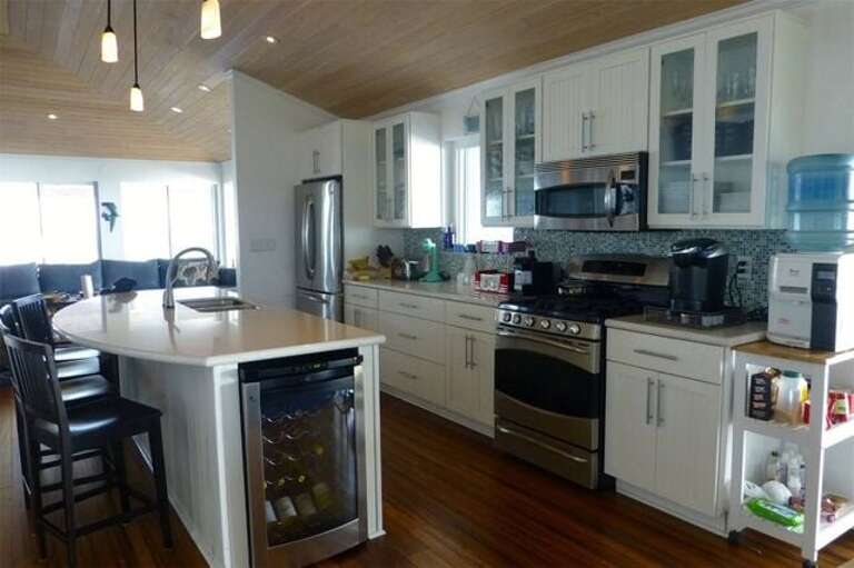 This is a true chef's kitchen with every imaginable appliance and utensil, extensive kitchenware, and high end china.