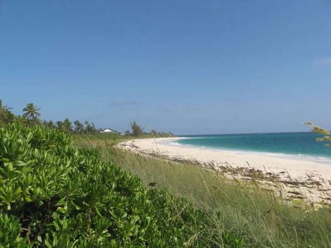 Our beach, a mile-long crescent of pinkish sand. Our beach, a mile-long crescent of pinkish sand.
