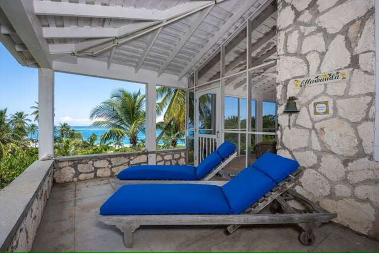 Covered porch lounging with ocean views. Covered porch lounging with ocean views.