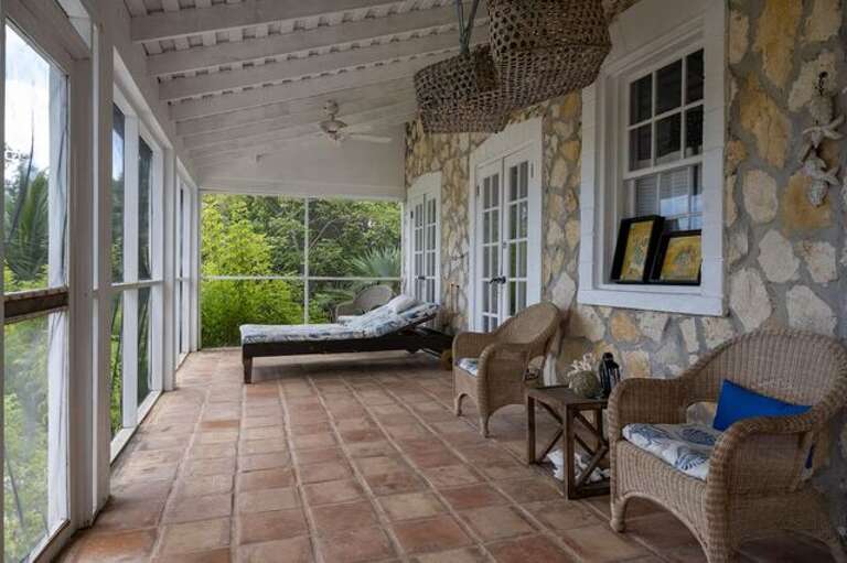 Screen porch chaise lounge and dining area. Screen porch chaise lounge and dining area.