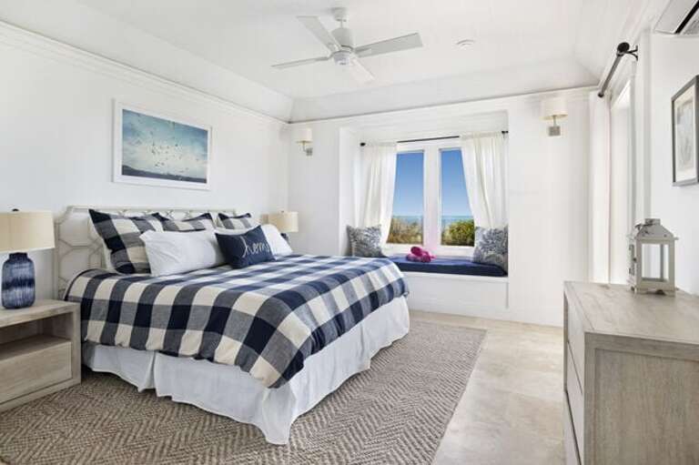 Master suite with balcony and 50-mile Caribbean view, facing the sunset.