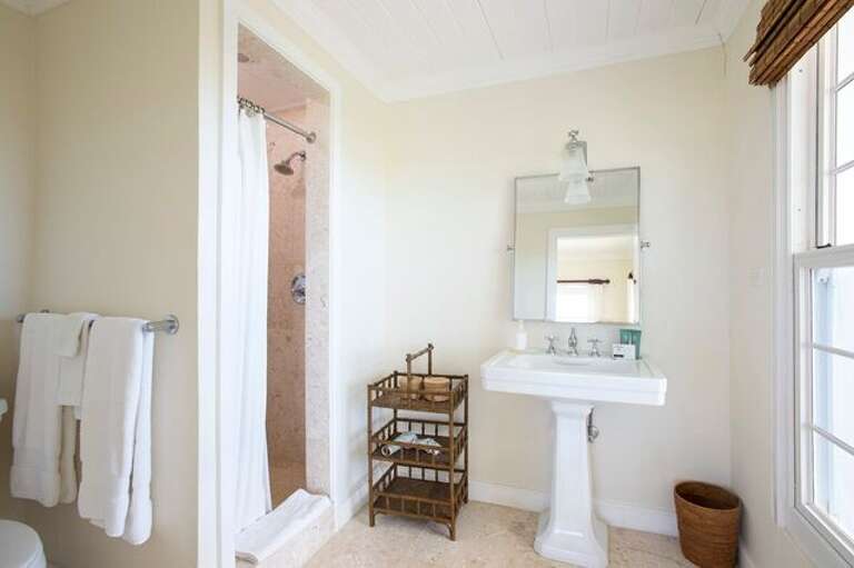 En suite full bath for the bedroom with two full beds.