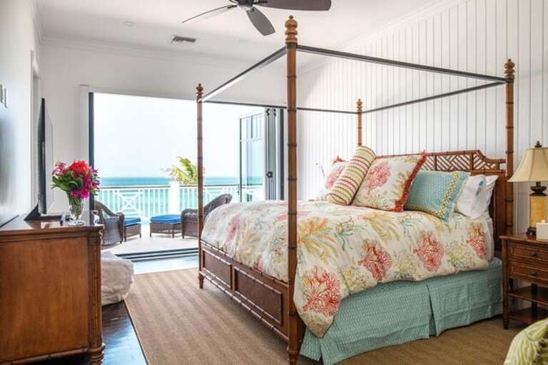 Aqua Room, upper level.  King size bed suite with walk in closet. Sliding door windows with optional screen to upper balcony patio overseeing ocean and pool.