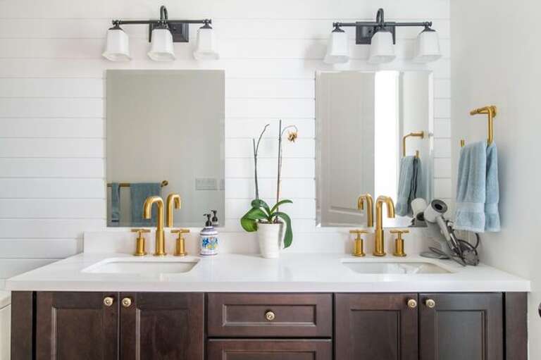 Bath with double sinks and walk in shower.