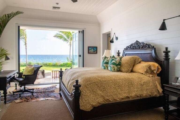 Master bedroom, downstairs, with a California king size bed, private desk, and walk-in closet.  All bedrooms have an en-suite bath.