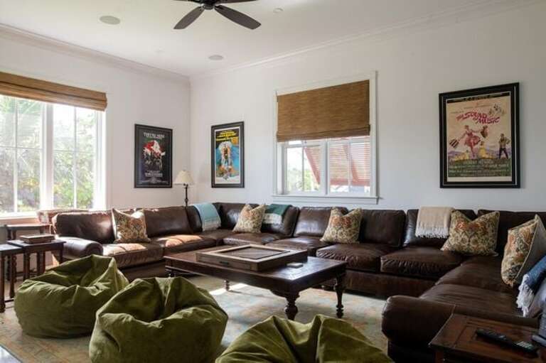 Media Room.  Large luxurious leather U-shaped sectional sofa and bean bag chairs, seats 24.