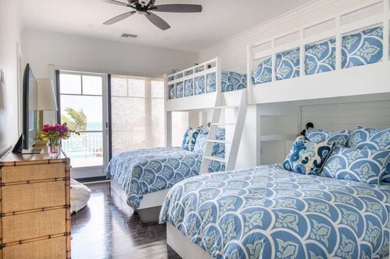 Ocean Room.  2 Lower Queen Size Bunk beds, 2 XL twins above with full closet. Sliding door windows with optional screens to upper balcony patio overlooking pool and ocean.