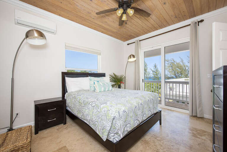 The Master bedroom is furnished with a king bed, it has a en-suite full bath and ocean view.