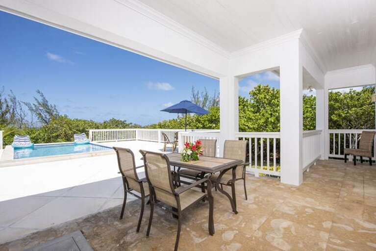 The patio is furnished for dining and lounging.  It has open areas for sunning and covered areas for shade.