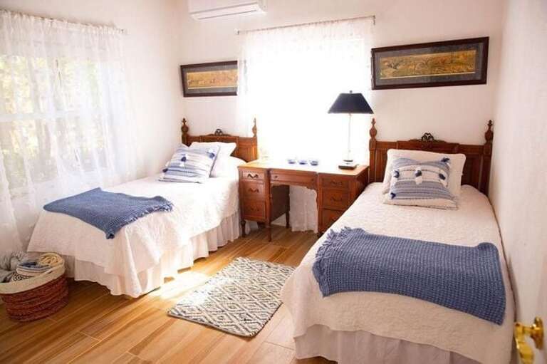 Upper Level Kids bedroom with two twin beds with ocean views, twin beds can be converted to a king