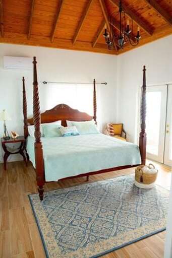 Upper level master bedroom with king size bed and ocean views