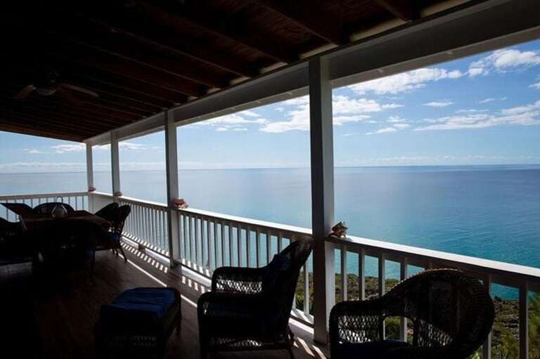 Upper Level Covered veranda with additional seating and dining.