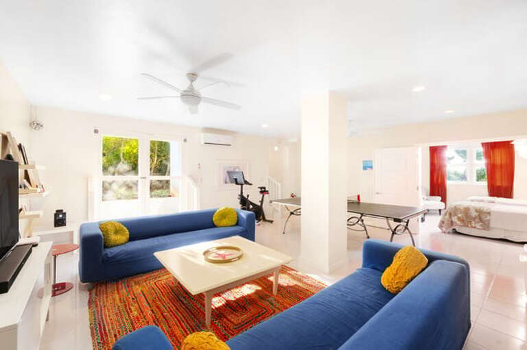 Big game/TV room with a multi-game table (air hockey, mini pool, etc), a full-size ping-pong table, TV, DVD player, and lots of board games.