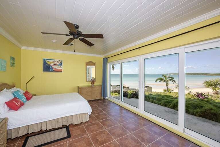 The second bedroom has a queen size bed with a wall of windows to enjoy the view of the beach with en-suite bathroom. The second bedroom has a queen size bed with a wall of windows to enjoy the view of the beach with en-suite bathroom.