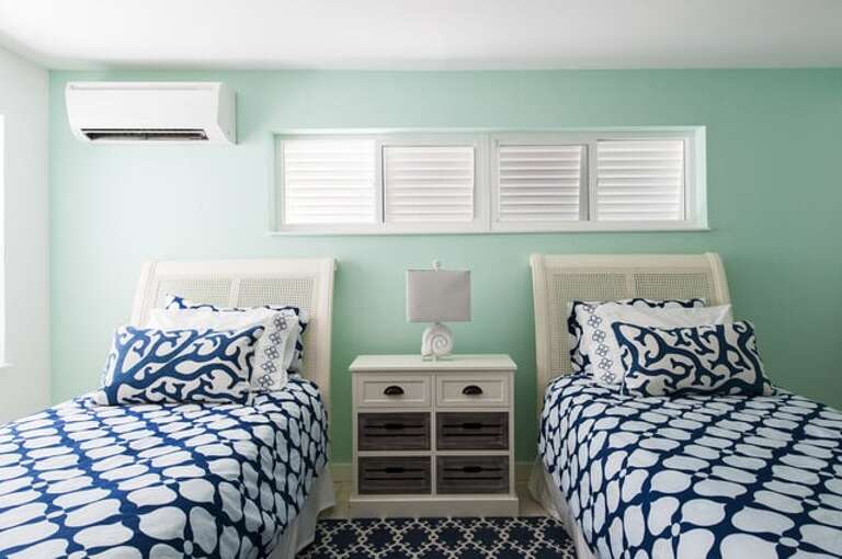 The second bedroom at Sunrise Villa has two single beds that can be converted into a king bed and a private bathroom.