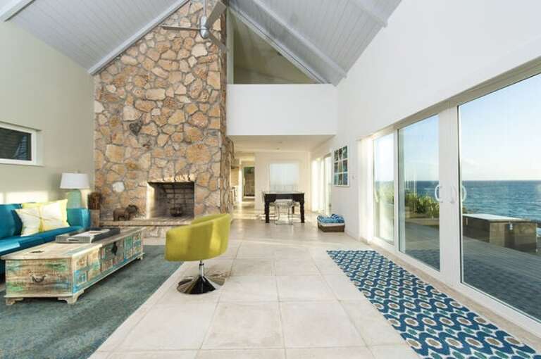 Enjoy panoramic ocean views from the Great Room at Sunrise Villa.