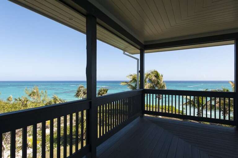 Expansive views of the ocean and island from wrap around deck at Sunset Villa