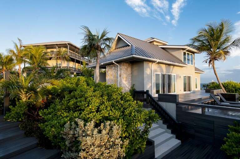 Sunset Villa and Sunrise Villa, this luxury estate has exceptional ocean views as well as 250 feet of gorgeous private pink-sand beach frontage.