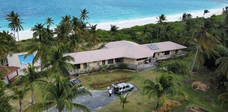 Aerial view of house and beach.