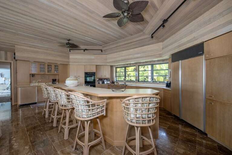 Fully equipped modern kitchen with additional seating at the island.