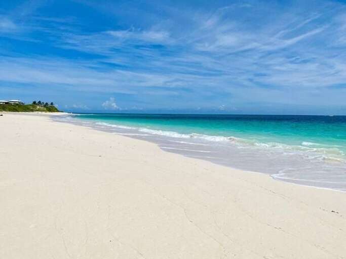 Our pristine beach facing north.  Beach is well protected by a barrier reef.