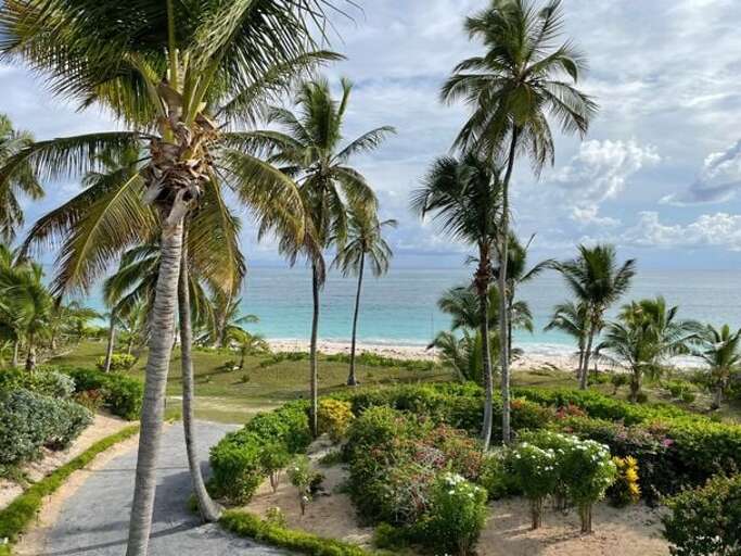 Our pristine beach is a mile long, wide and flat, with beautiful pinkish sand and the clearest water.