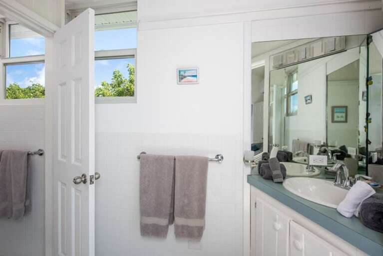 One of the two guest house en-suite baths.  The open door leads to the shower.