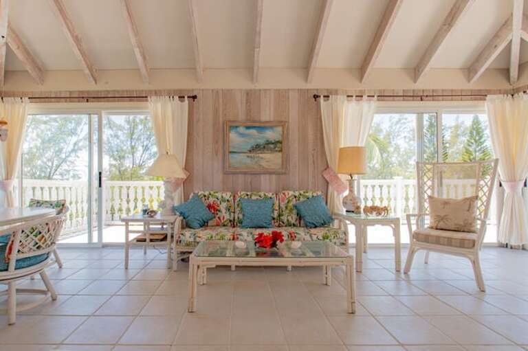 Villa Sundowner is designed in “Old Bahamian” style with the living room area taking up the entire 2nd floor Villa Sundowner is designed in “Old Bahamian” style with the living room area taking up the entire 2nd floor