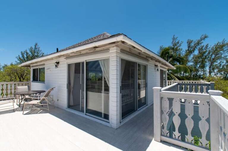 Wrap around deck with dining and seating Wrap around deck with dining and seating