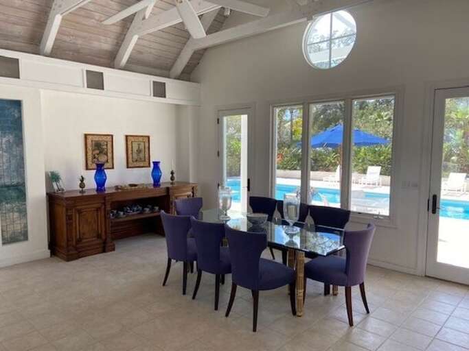 On the west side of the great room is the dining area, overlooking the pool On the west side of the great room is the dining area, overlooking the pool