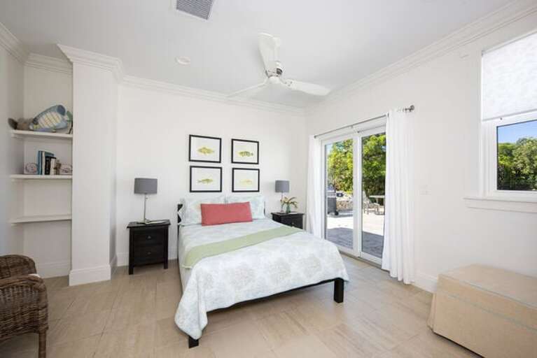 Guest bedroom 1 with private deck Guest bedroom 1 with private deck