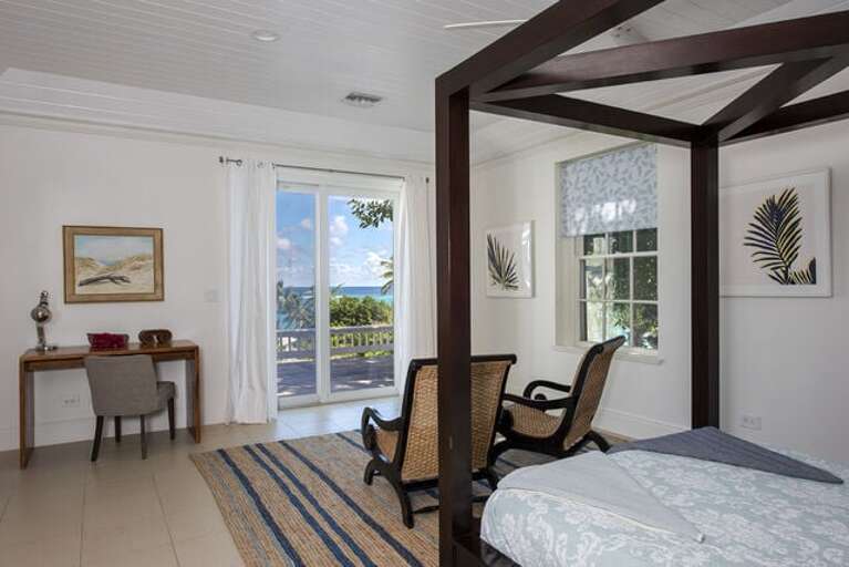 Master Bedroom with private deck, large en suite bath and queen-size canopy bed, a spacious and delightful room Master Bedroom with private deck, large en suite bath and queen-size canopy bed, a spacious and delightful room