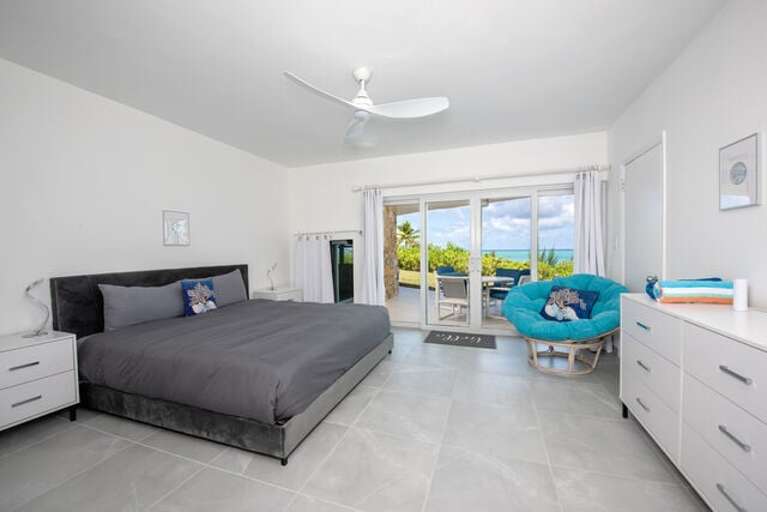 Bedroom Two with king bed, en suite bath, and ocean views.  A TV is on order and will be in place soon.