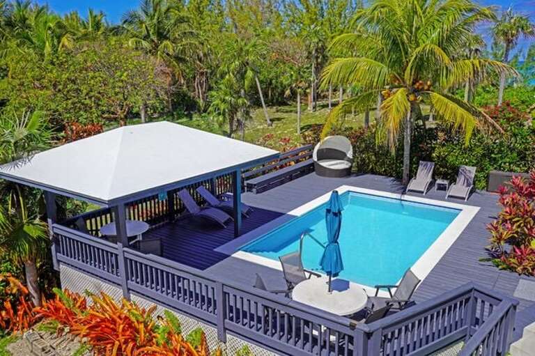 Private pool with large deck and wooden gazebo providing full coverage from the sun.